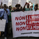 FILE PHOTO: Anti-LGBT demonstrators march through the streets during a protest calling for tougher action in Dakar